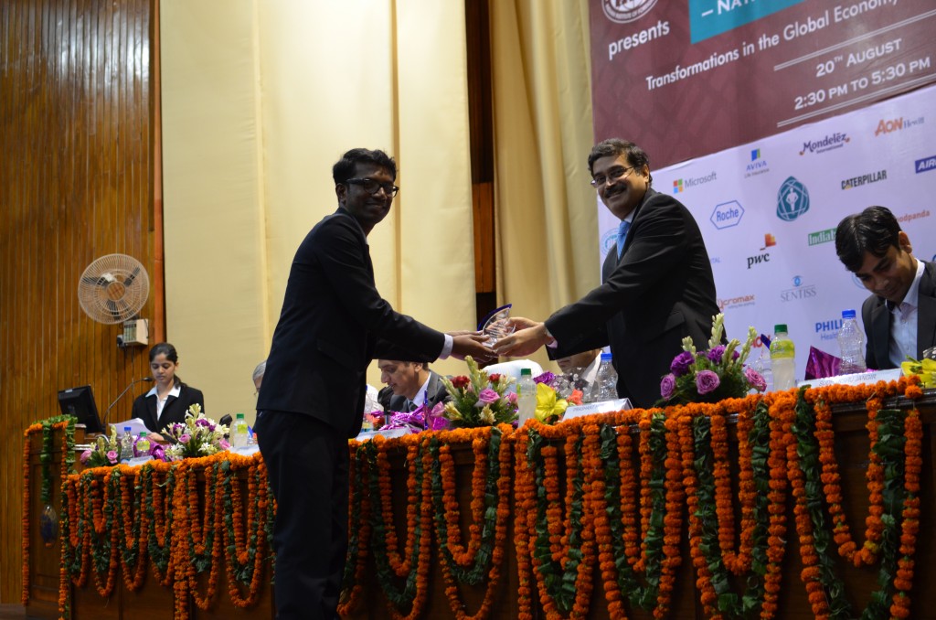Recently the student council at IIFT organised a  business conclave "Trade Winds". Here Vinay is presenting a memento to Mr. Prashant Hoskote, Senior Director, Max India Group who spoke at the event.