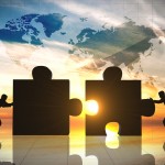 World Business teamwork puzzle pieces