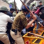 Police personnel baton charge on the students of Jamila Millia Islamia University as they started pelting stones