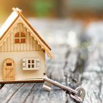 house-and-key-on-wooden-table-on-sunlight–background–building-concept-concept-of-selling-real-estate–1138190269-563869f4765c46a3a194e83d80ca61eb