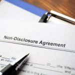 Legal document Non-Disclosure Agreement on paper close up